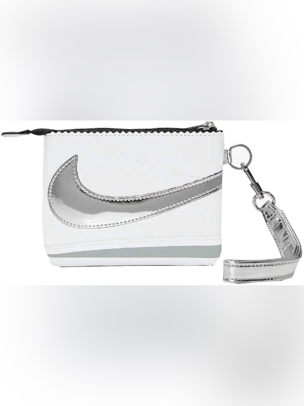 The Nike Icon Cortez Wristlet in white and silver